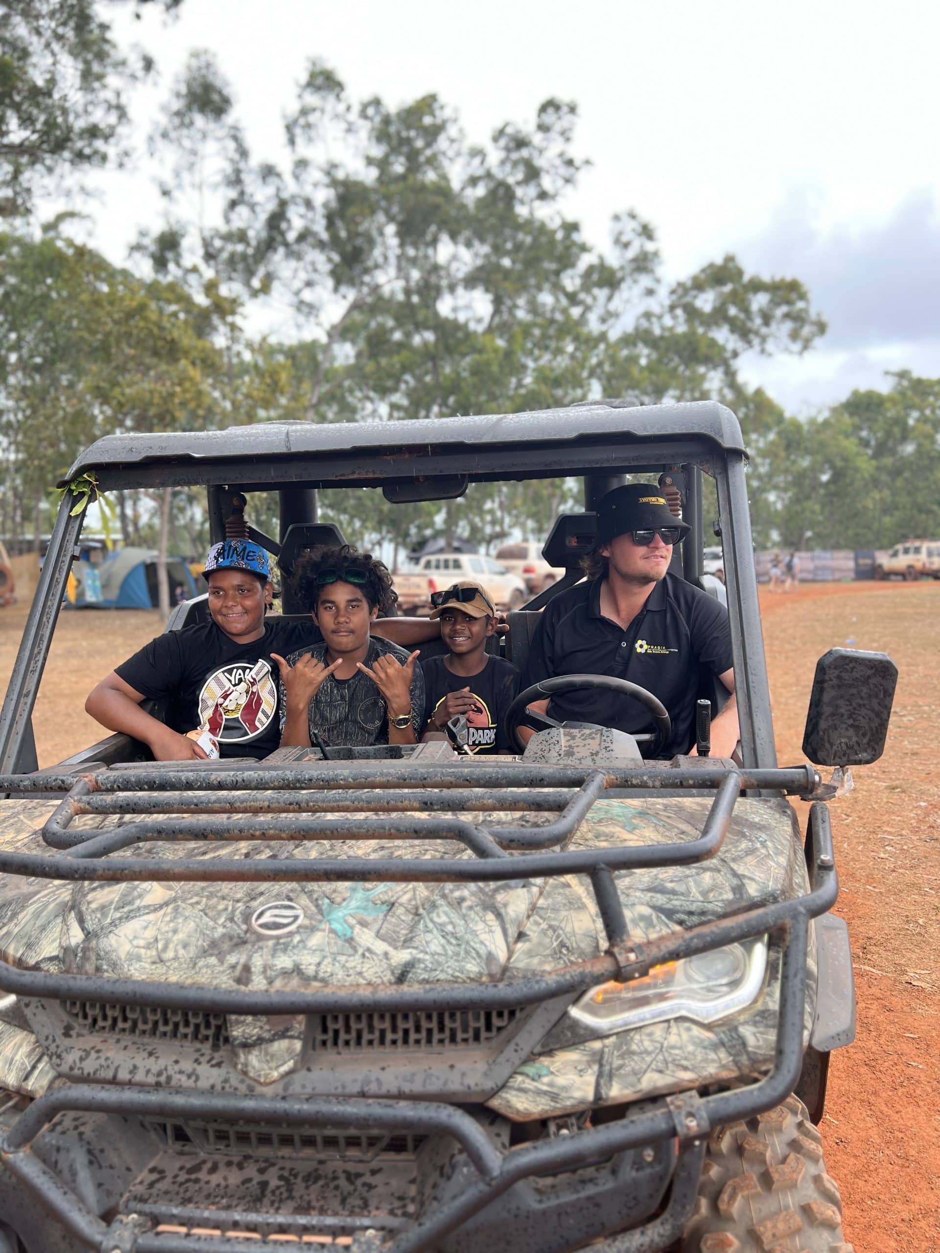 Group of participants on a community outing in an off-road buggy in the NT