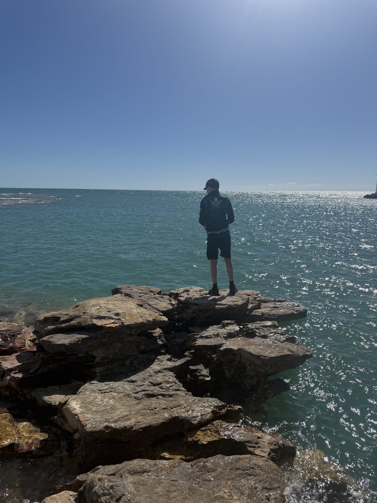 Participant taking in the view from the coastline in the Northern Territory