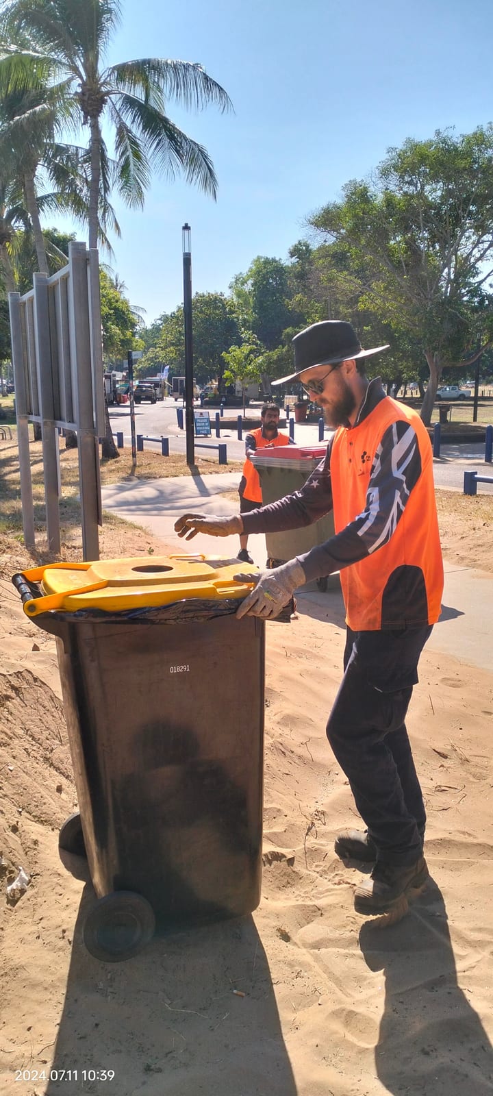 Participant helping with grounds work at a local park in Darwin