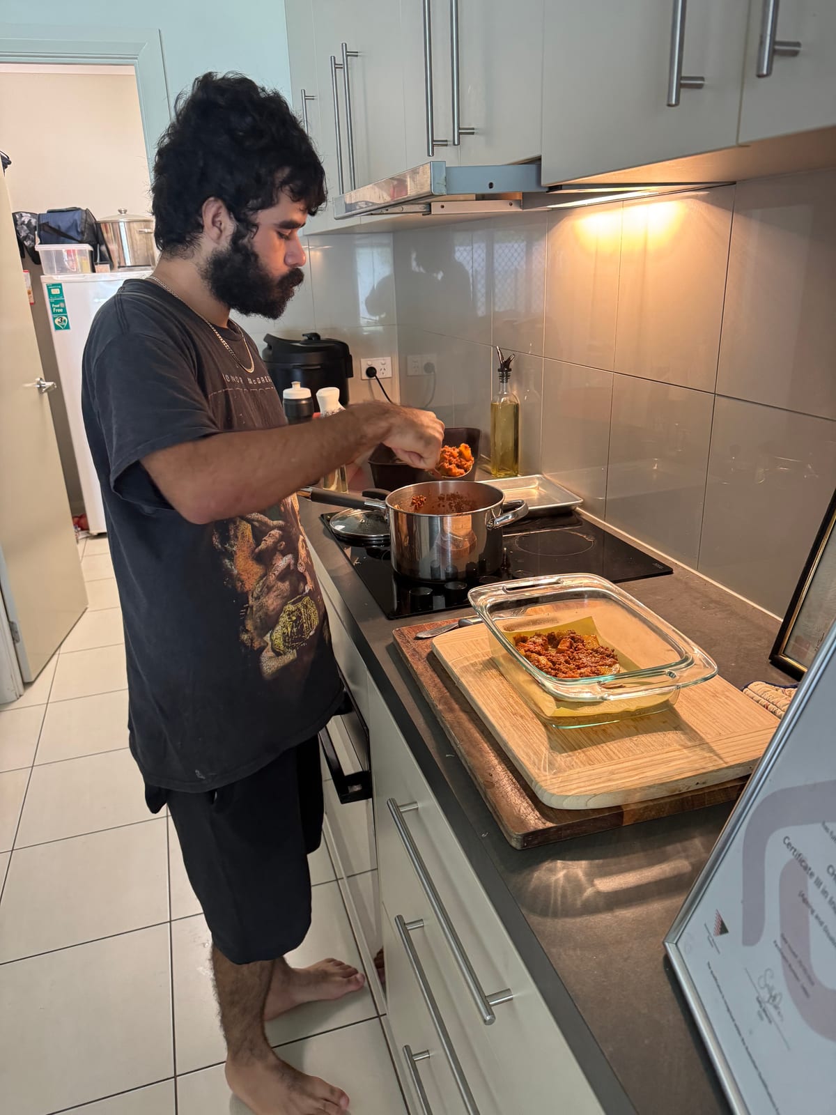 Participant preparing a meal at home with daily living support