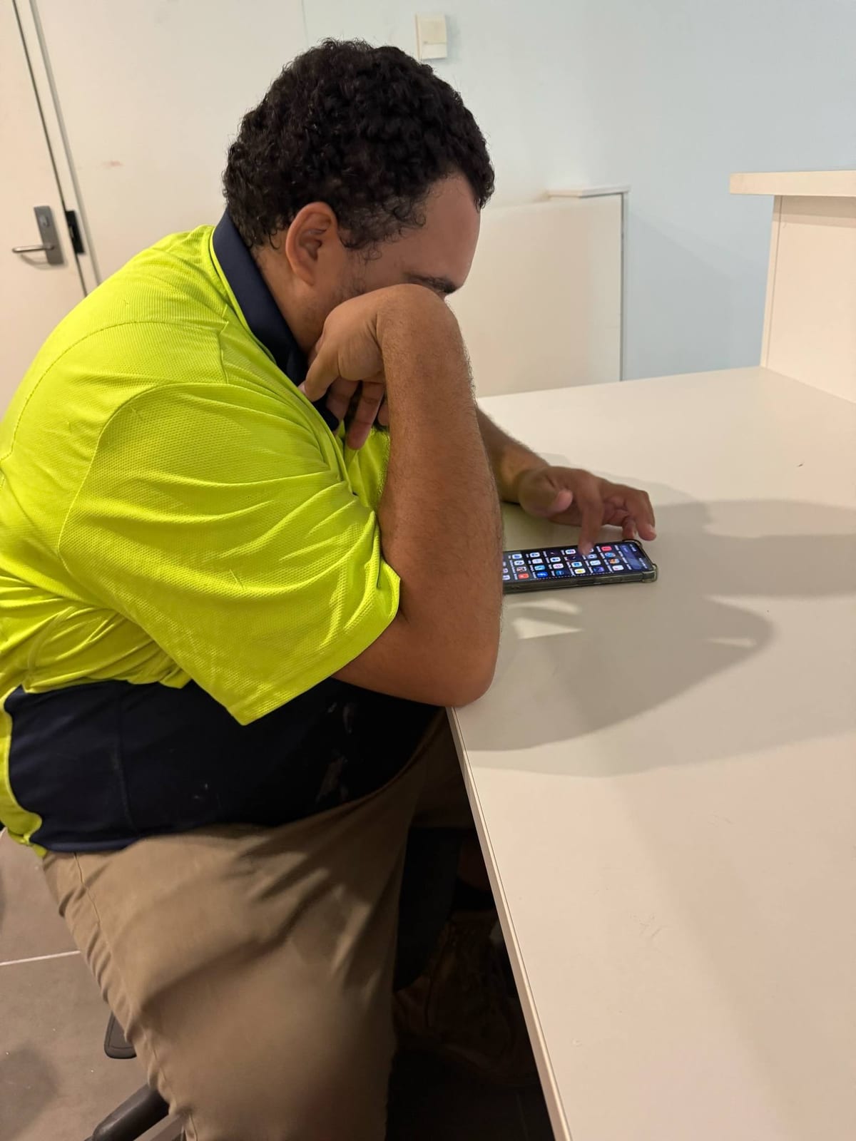 Participant working at an office desk while building employment skills