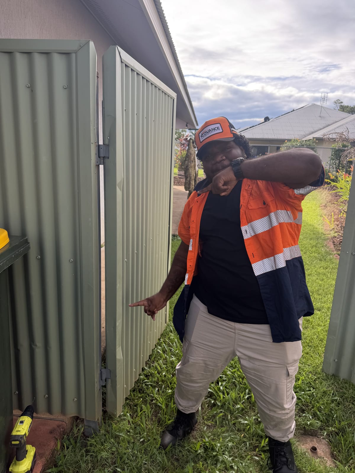 Northern Purpose participant in hi-vis outside a Darwin home
