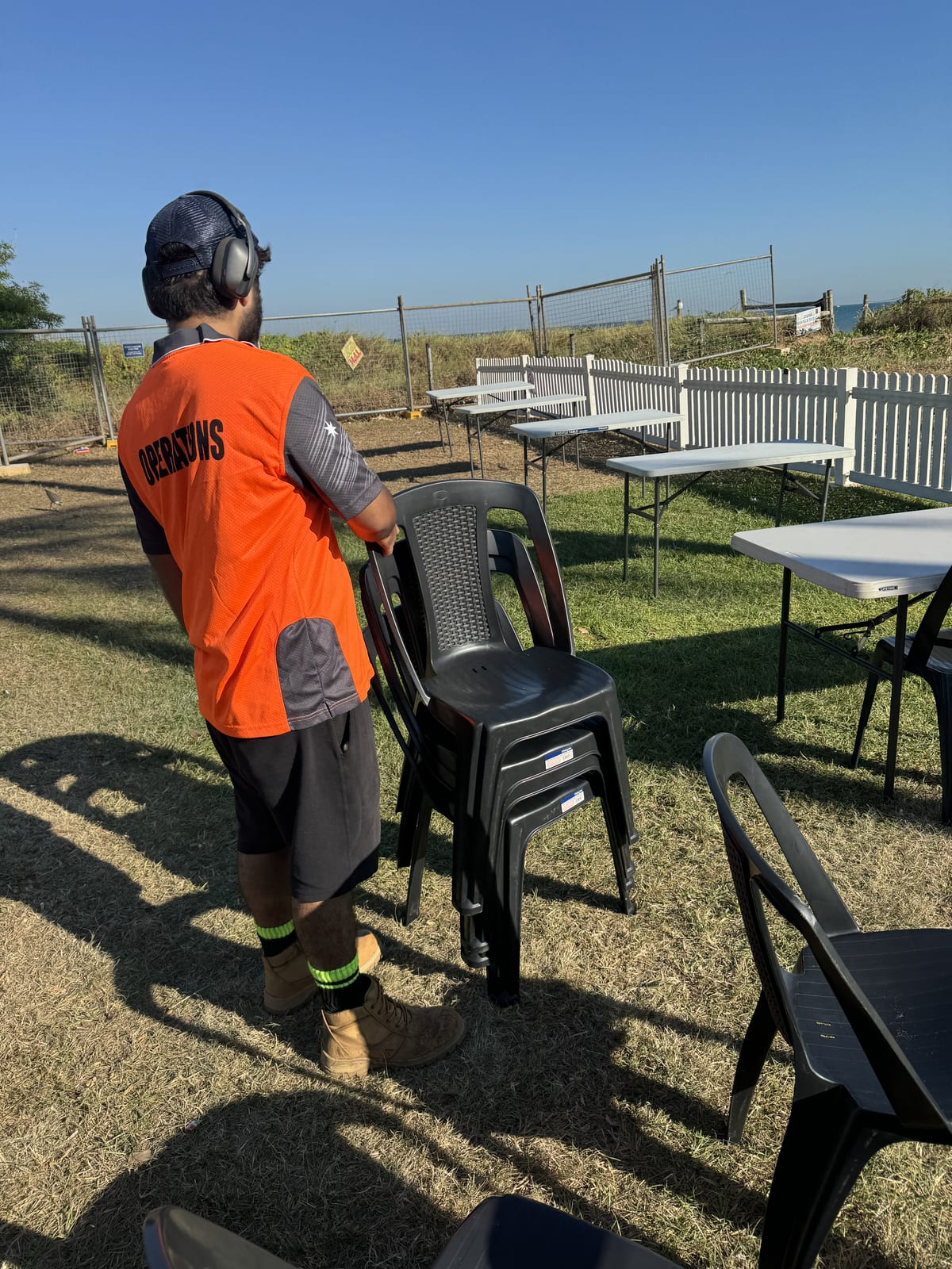 Participant setting up chairs for a community event