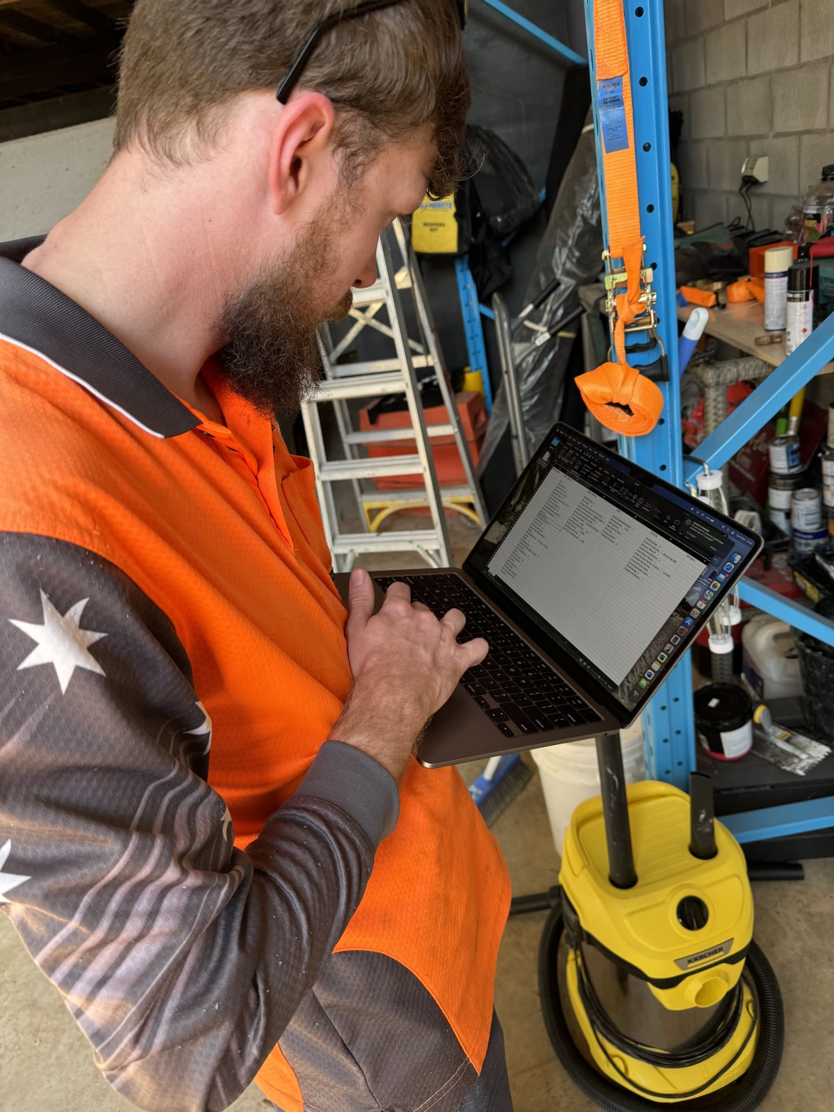 Participant operating glass-lifting equipment during supported work