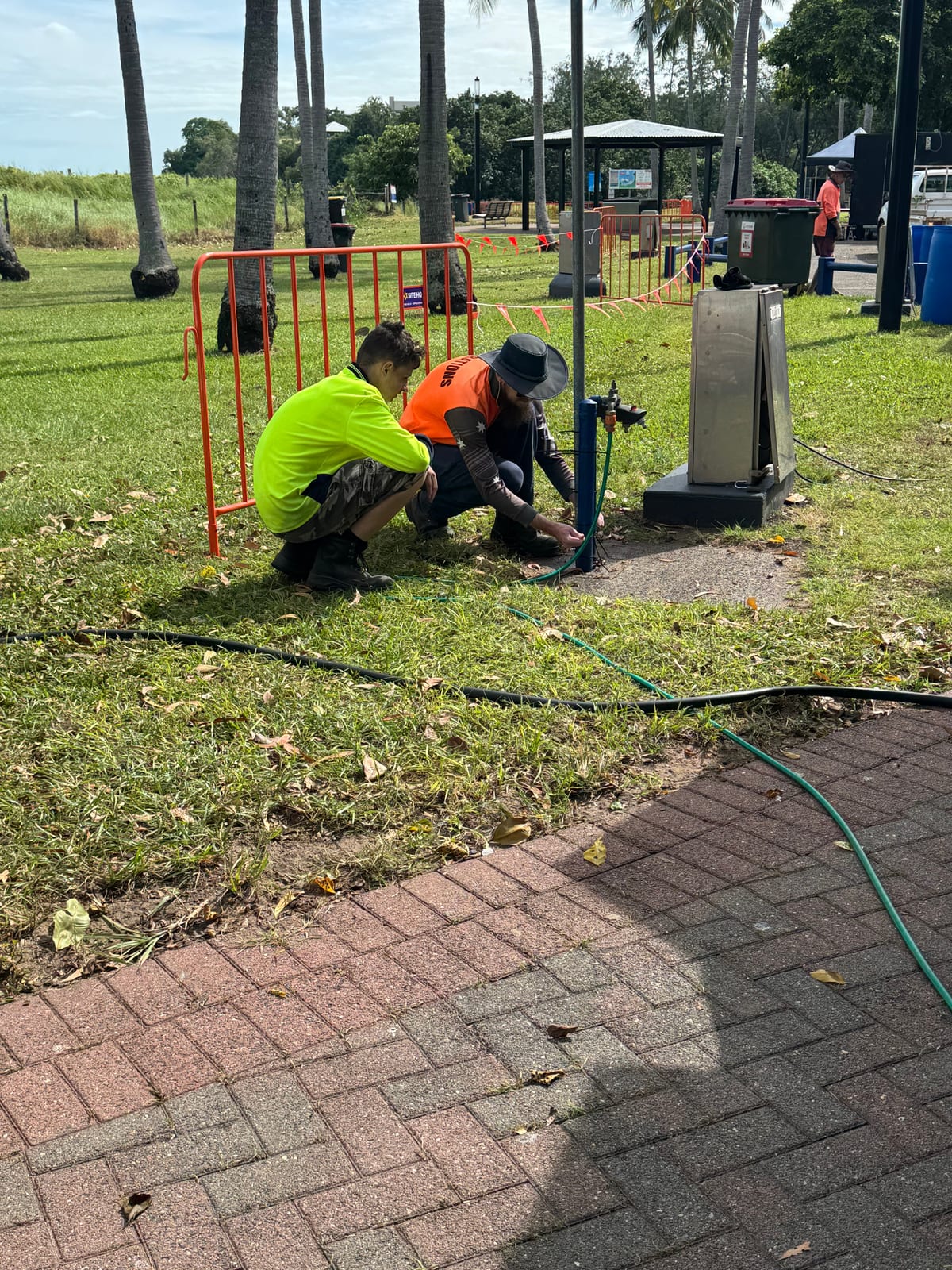 Participant doing grounds and maintenance work at a Darwin park