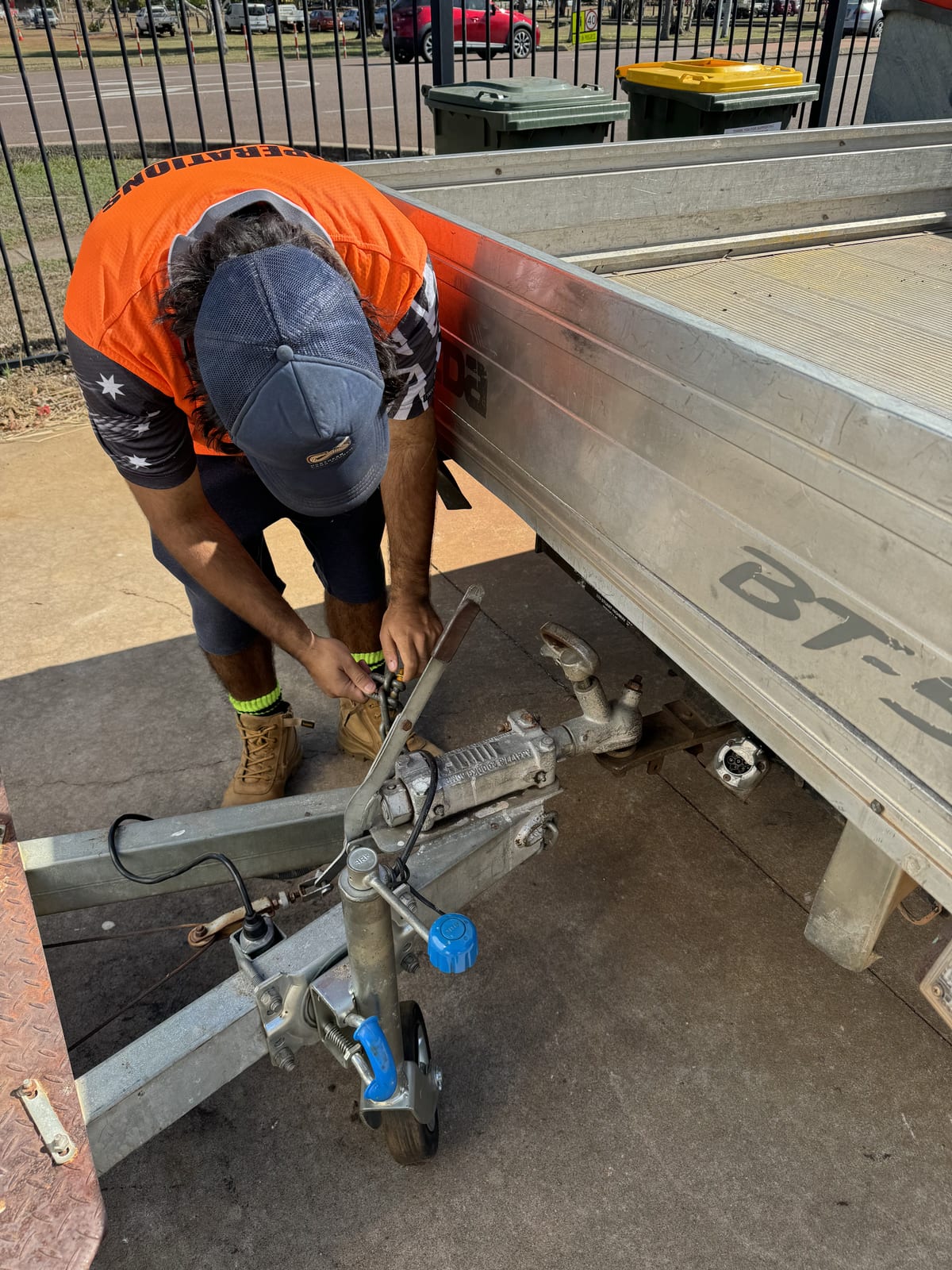Participant repairing a trailer coupling during hands-on supported work